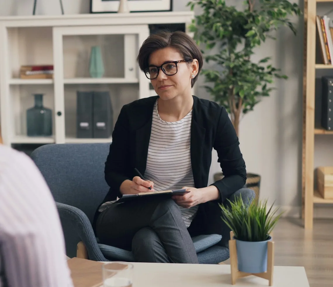 A therapist talking with a client in the consulting room