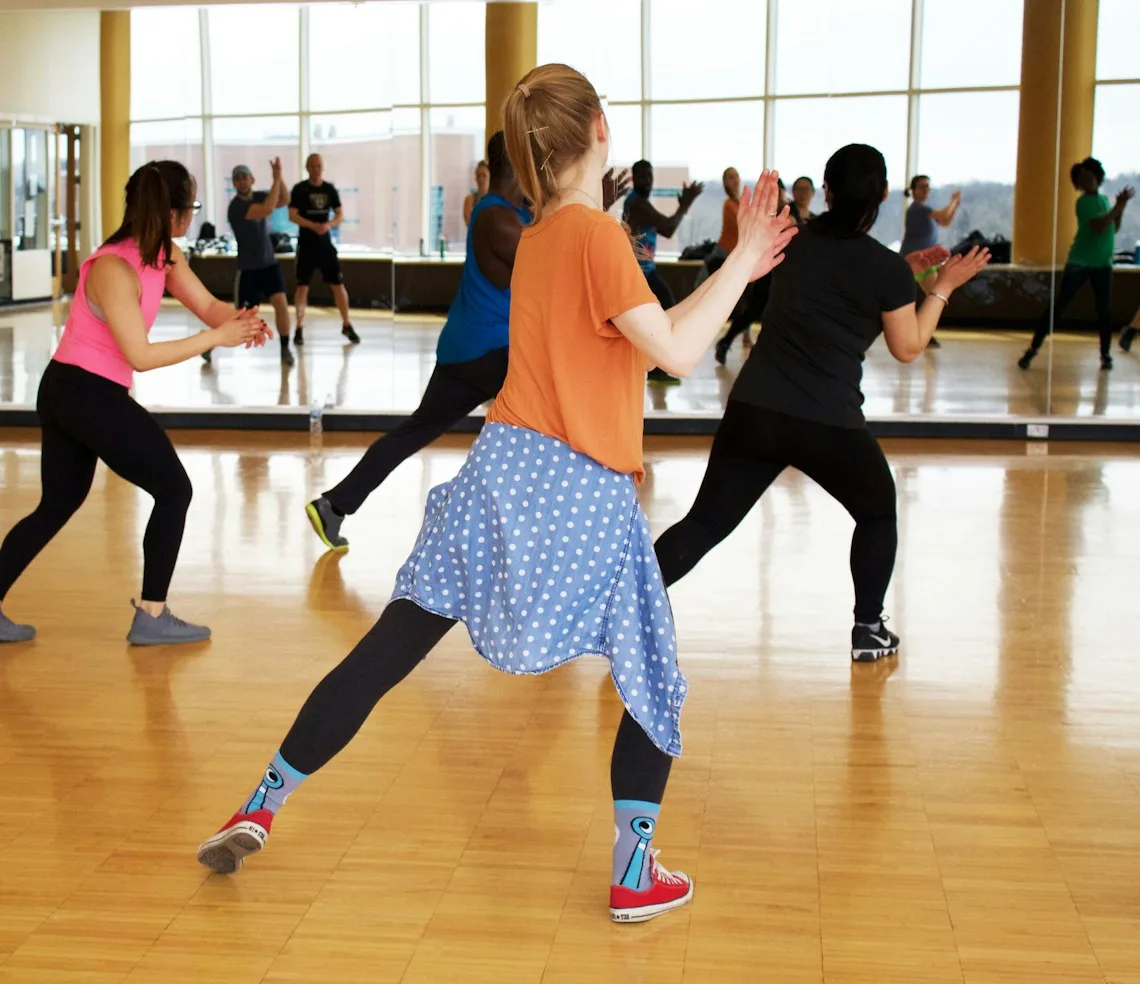 A group class training in a bright fitness studio