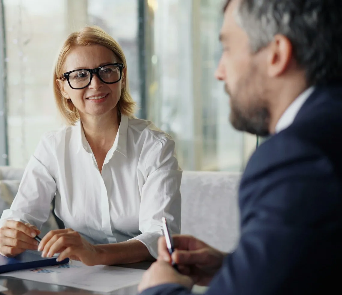 A lawyer advising a client across a desk