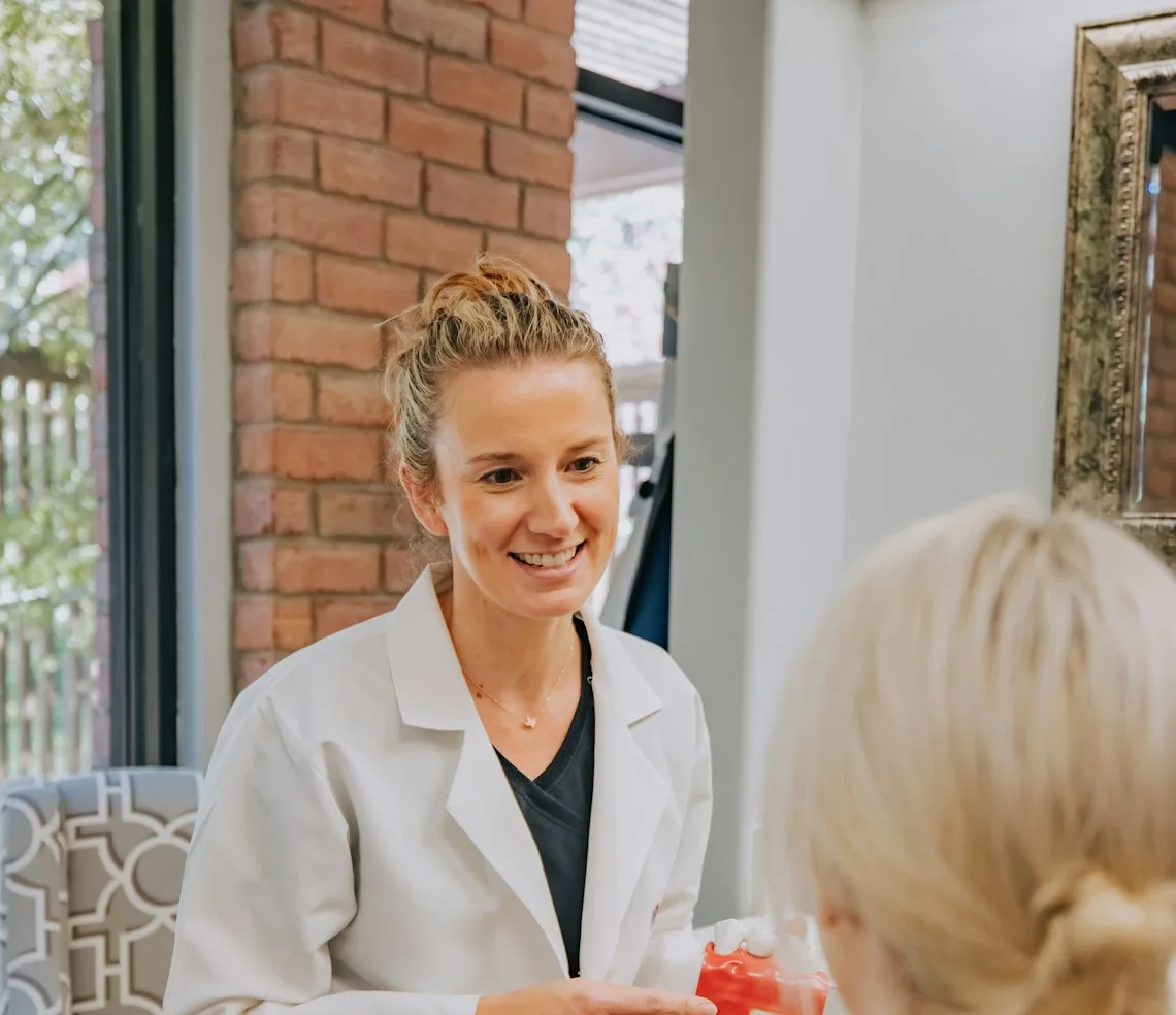 A doctor consulting a patient in their own consulting room
