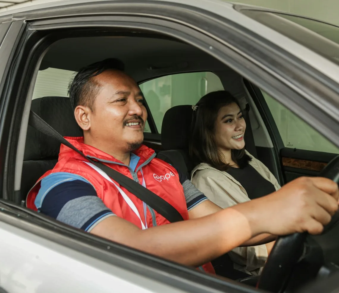An instructor running a driving lesson with a learner