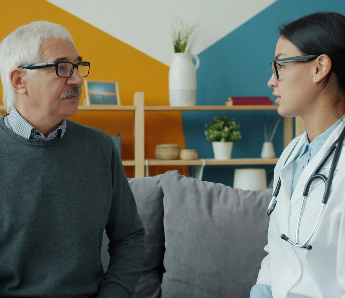 A doctor talking with a patient at an appointment in the clinic