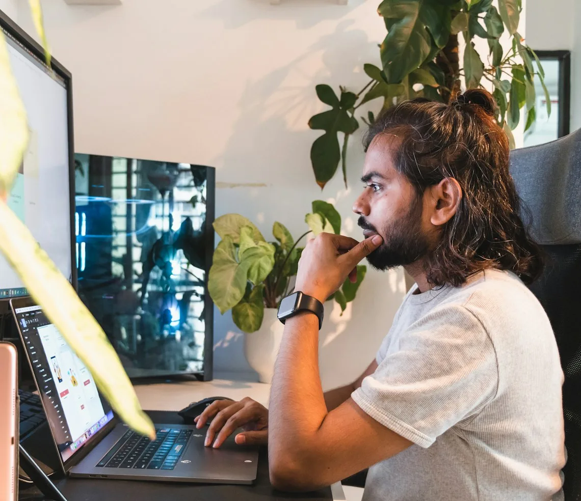 A designer working on a layout at their computer