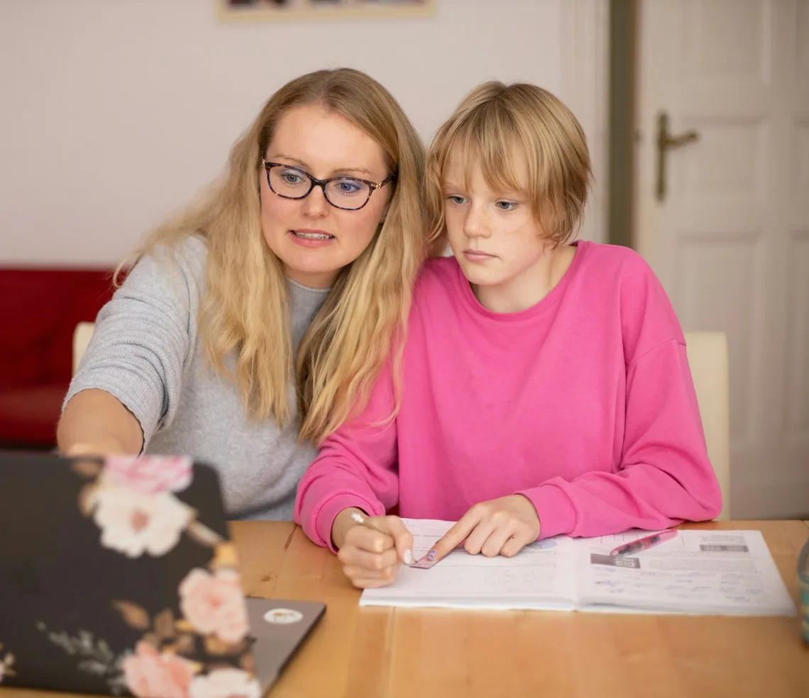 A tutor working through a lesson with a student